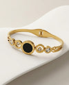 Gold Tone Roman Numeral Bangle Bracelet with Black Inlay and Clear Stones